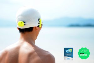 Man wearing a Marlin looking at the sea, with icons for CES innovation award and Kickstarter beside him