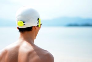 Man wearing a Marlin, looking out into the sea.